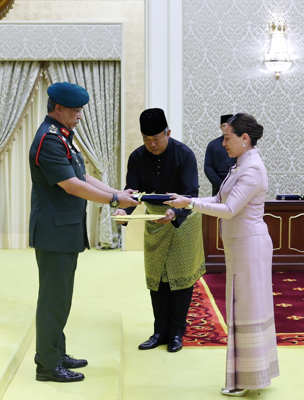 Yang di-Pertuan Agong Al-Sultan Abdullah Ri'ayatuddin Al-Mustafa Billah Shah receiving the credentials of Thailand Ambassador to Malaysia Lada Phumas at Istana Negara today. — Bernama pic