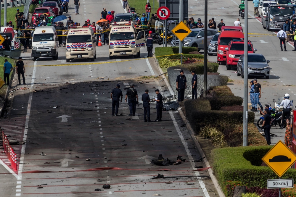 Police and rescue personnel pictured at the plane crash site in Elmina, Shah Alam, August 17, 2023. — Picture by Firdaus Latif