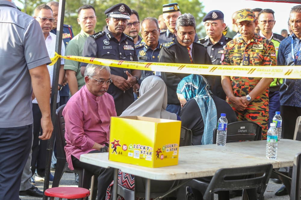 Yang di-Pertuan Agong Al-SUltan Abdullah Ri'ayatuddin Al-Mustafa Billah Shah express his sadness as he meeting with family members and relatives at plane crash site in Bandar Elmina,Shah Alam August 17, 2023. Picture by Yusof Mat Isa