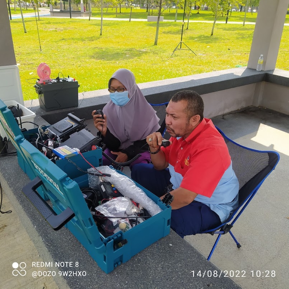 Amateur radio users Ahmad Faizal Hassan (callsign 9W2UBS) and Siti Khadijah Ismail (9W2UBC) participate in an emergency communication station simulation in Cheras. — Picture courtesy of MARTS