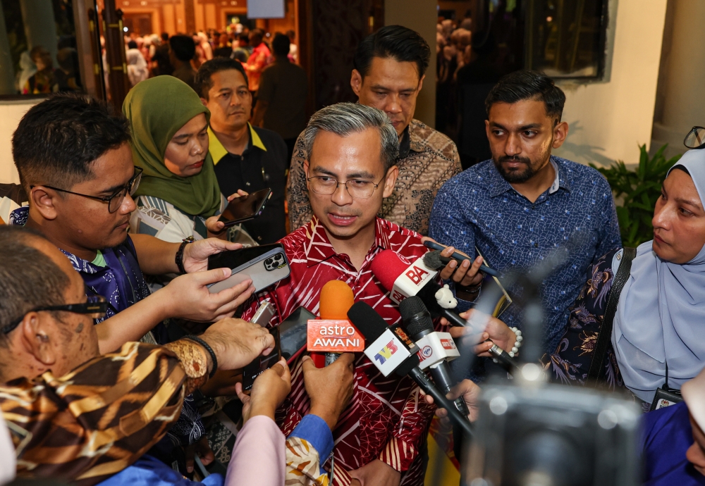 Communications and Digital Minister Fahmi Fadzil speaks to the media after attending the “Menyemai Semangat Kesetiaan Kepada Raja dan Negara” programme in Ipoh August 19, 2023. — Bernama pic