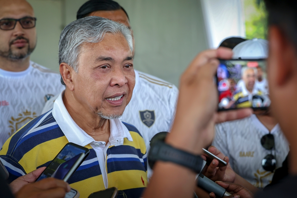 Deputy Prime Minister Datuk Seri Ahmad Zahid Hamidi speaks reporters after opening the 2023 Datuk Seri Dr Ahmad Zahid Hamidi Cup football tournament in Putrajaya August 20, 2023. — Bernama pic