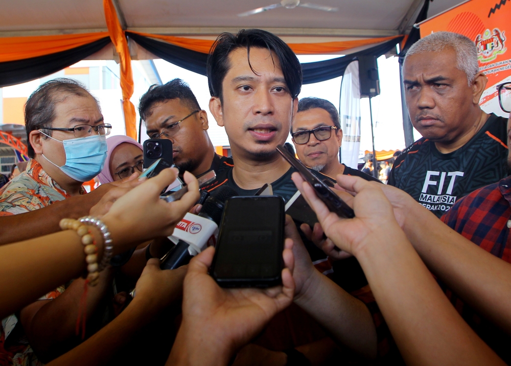 Deputy Youth and Sports Minister Adam Adli Abd Halim speaks to the media after launching the Perak-level Fit Malaysia Programme at the Youth and Sports Complex in Ipoh August 20, 2023. — Bernama pic