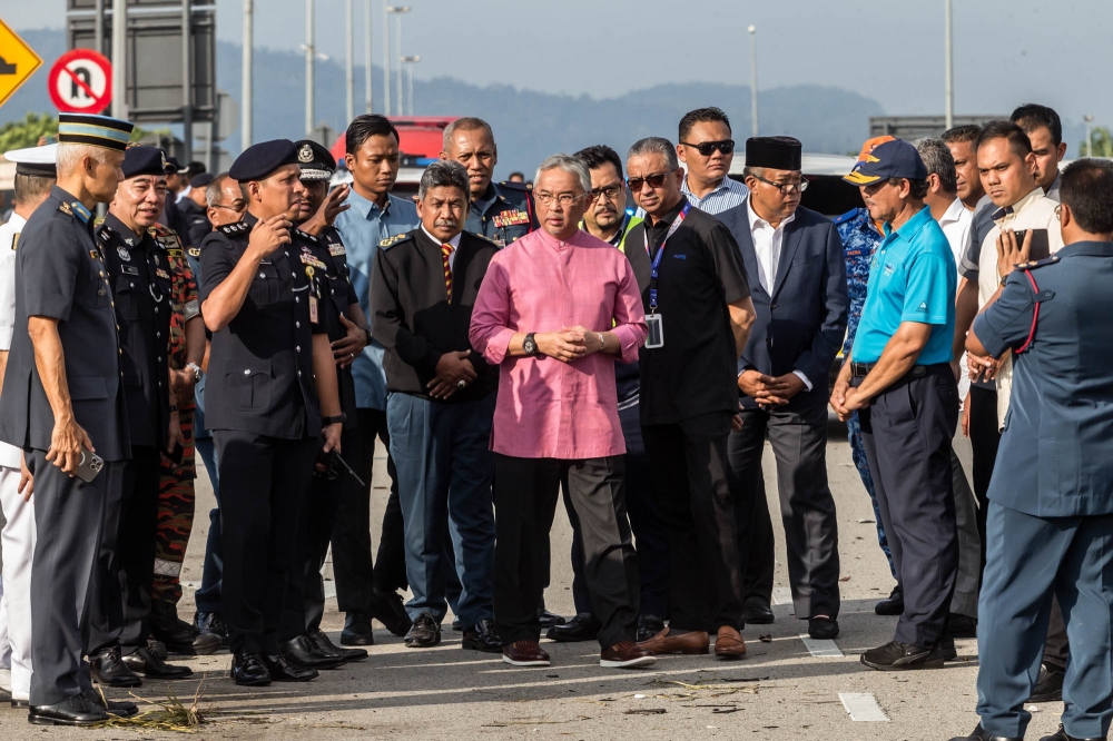 Yang di-Pertuan Agong Al-Sultan Abdullah Ri’ayatuddin Al-Mustafa Billah Shah at the site of the crash on August 17, 2023. — Picture by Firdaus Latif