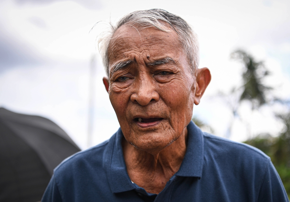 Mohamed Nuaidi, father of Elmina crash victim Mohd Naim Fawwaz, speaks to reporters after his son’s funeral at the Sungai Kantan Muslim Cemetery in Kajang August 20, 2023. — Bernama pic