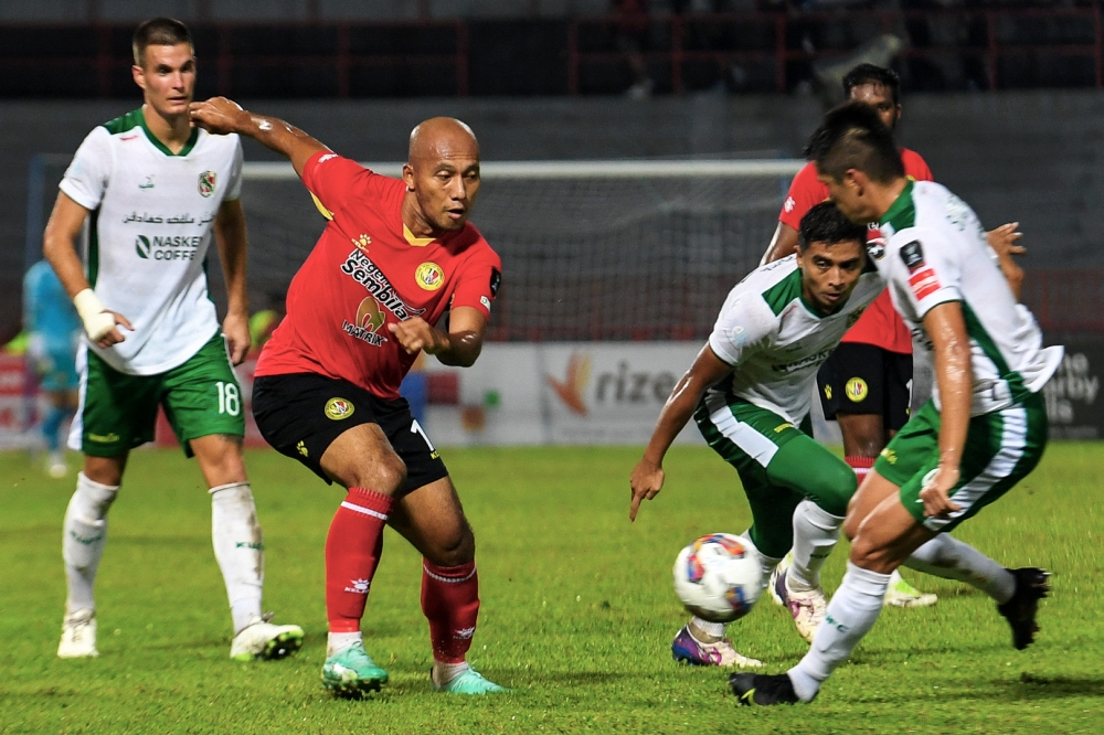 Negeri Sembilan FC player Mahalli Jasuli (second left) in action during the match against Kelantan United at the Tuanku Abdul Rahman Stadium in  Paroi August 20, 2023. — Bernama pic