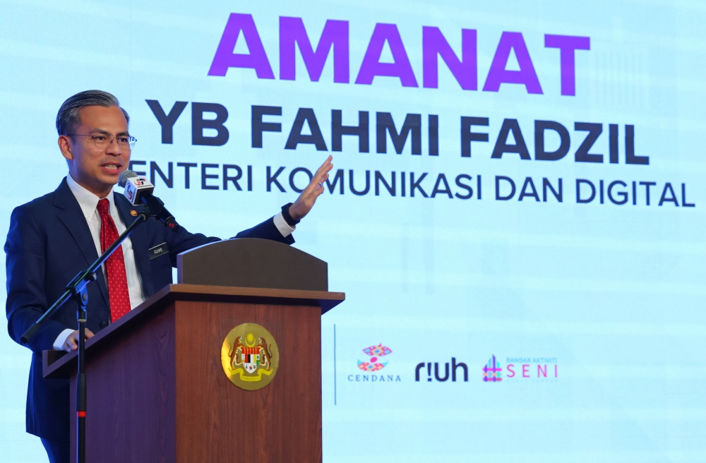 Communications and Digital Minister Fahmi Fadzil delivers a speech during the ministry’s monthly assembly in Putrajaya August 21, 2023. — Bernama pic
