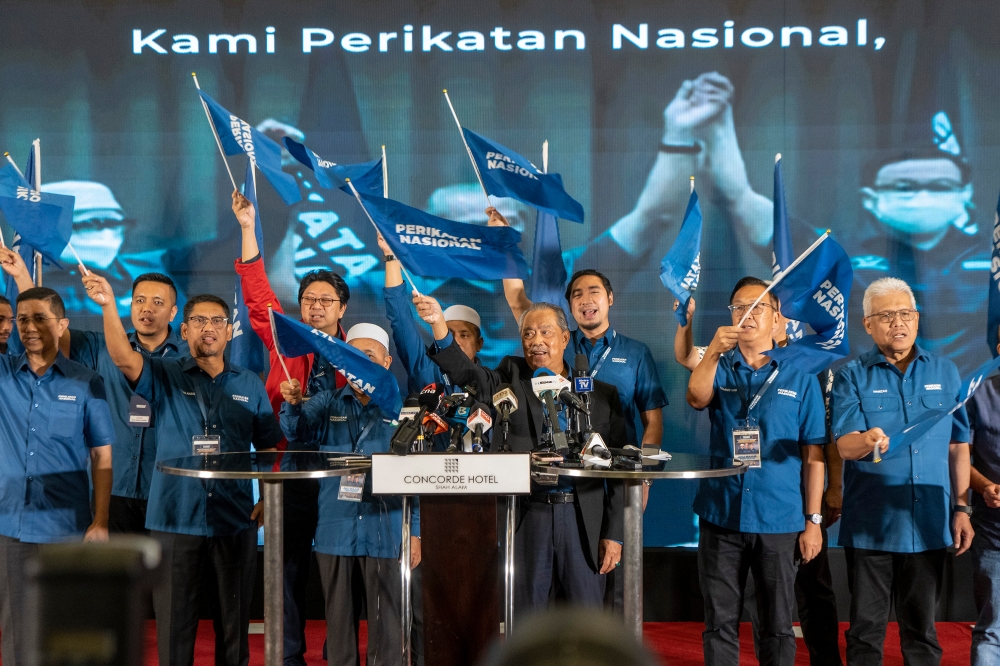 Perikatan Nasional chairman Tan Sri Muhyiddin Yassin and other members celebrating PN’s state election victory in Shah Alam, August 12, 2022. — Pictures by Shafwan Zaidon