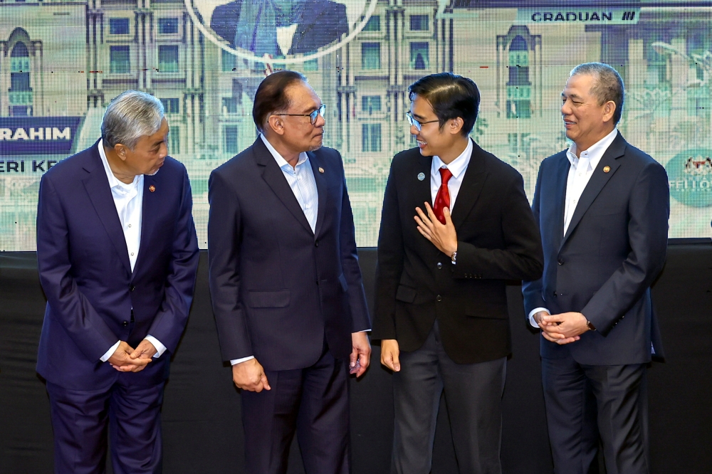 Prime Minister Datuk Seri Anwar Ibrahim (second from left) attends the presentation ceremony of Perdana Fellows in Putrajaya August 23, 2023. — Bernama pic