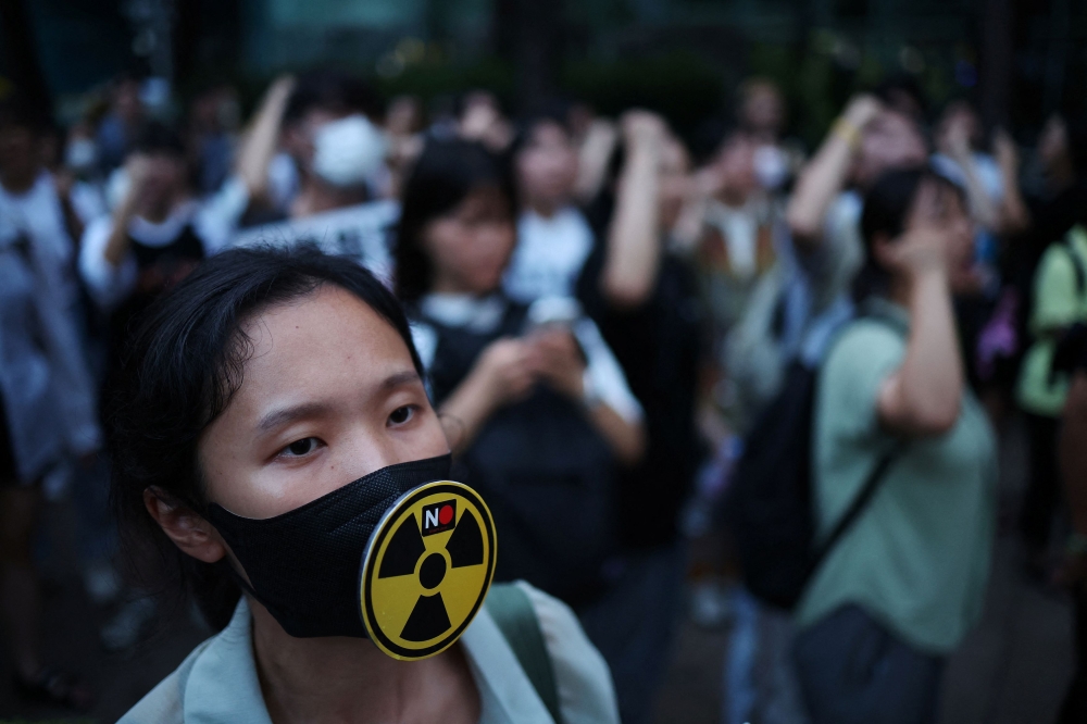 South Korea’s majority opposition party and civic groups around the country stepped up protests today against Japan’s plan to release water from the Fukushima nuclear plant a day ahead of the planned start of the discharge. — Reuters pic