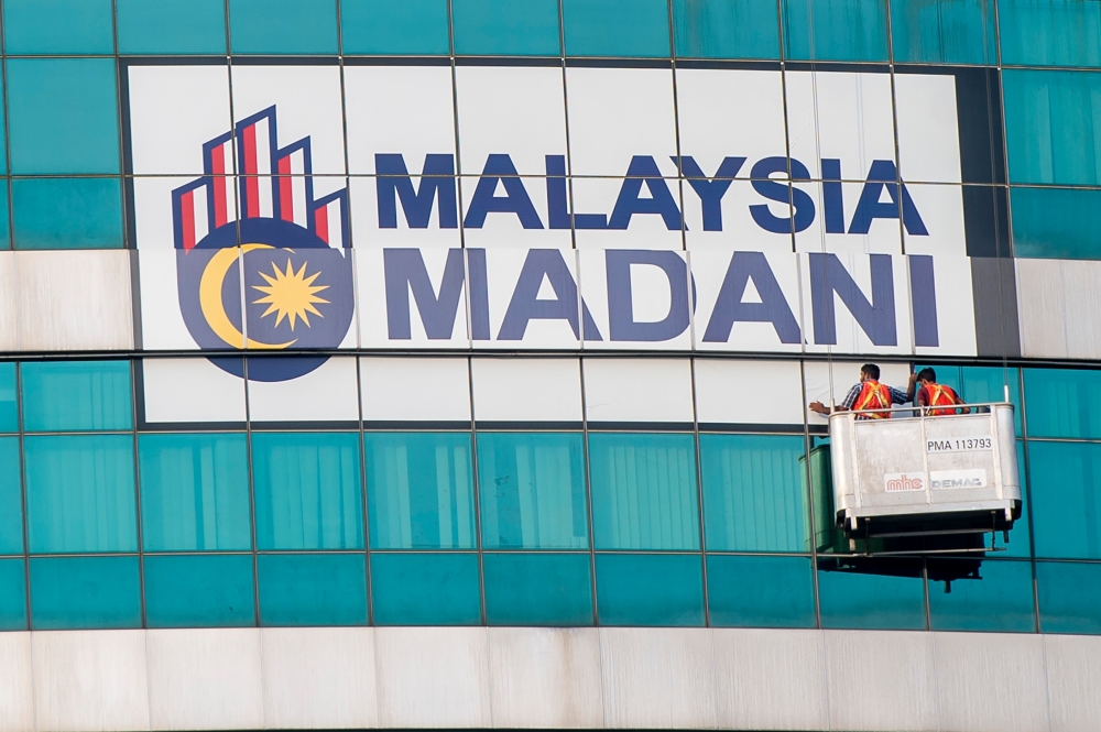 The Malaysia Madani slogan is seen installed on a building in Putrajaya in conjunction with Malaysia’s 66th National Day celebration, August 23 2023. — Picture by Shafwan Zaidon