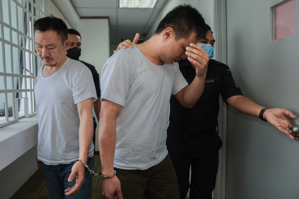 The accused, Choong Boon Wah, 44, and Seng Chun Leong, 44, were jointly charged with trafficking 413,826kg of the drug Nimetazepam (Erimin 5) in a house in Jalan Sri Klebang 2, Bandar Baru Sri Klebang, Chemor, at 9.15am last August 15. — Bernama pic 