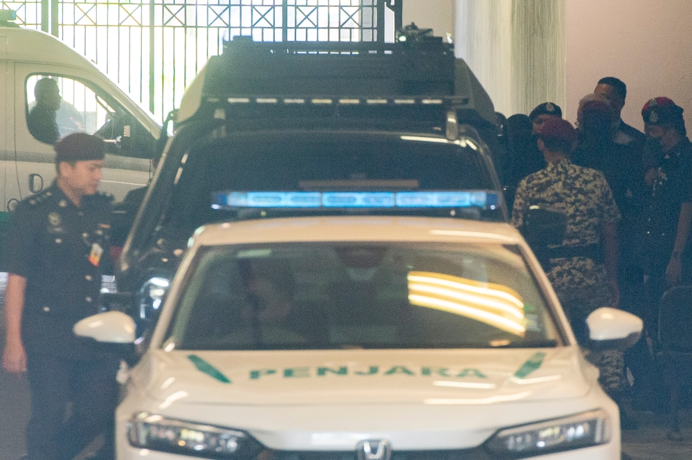A motorcade carrying former premier Datuk Seri Najib Razak was seen leaving the compound after the 1MDB case at the Palace of Justice, 25 August 2023. — Picture by Shafwan Zaidon