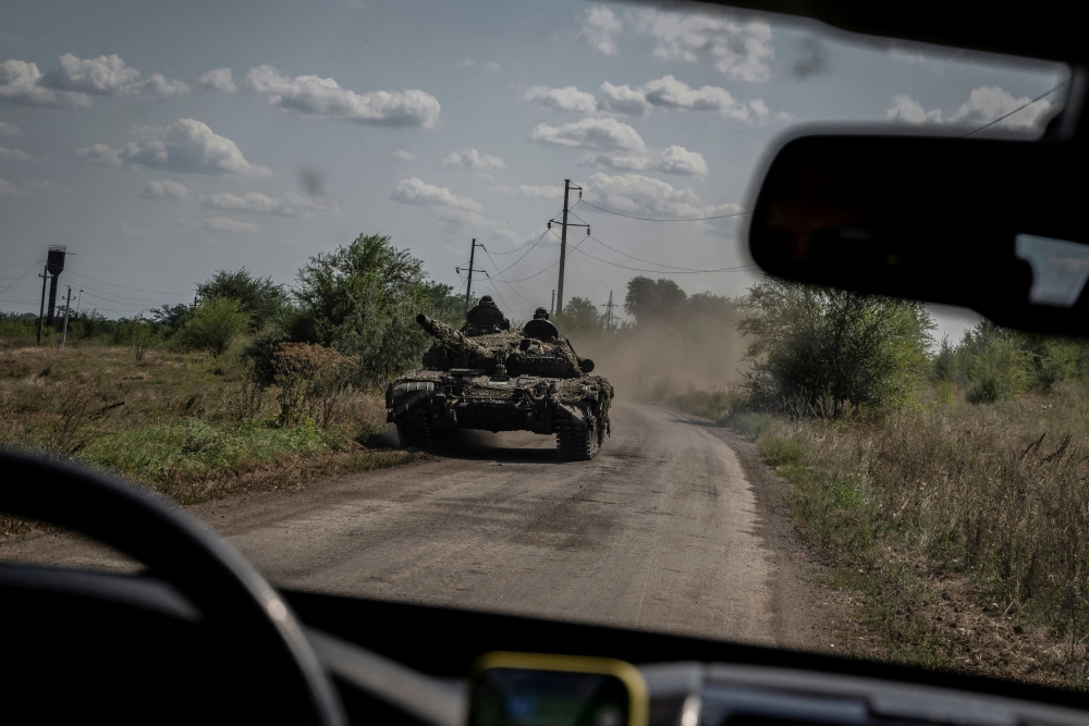 Ukrainian servicemen ride a tank, as Russia's attack on Ukraine continues, near the village of Robotyne, Zaporizhzhia region, Ukraine August 25, 2023. ― Reuters pic