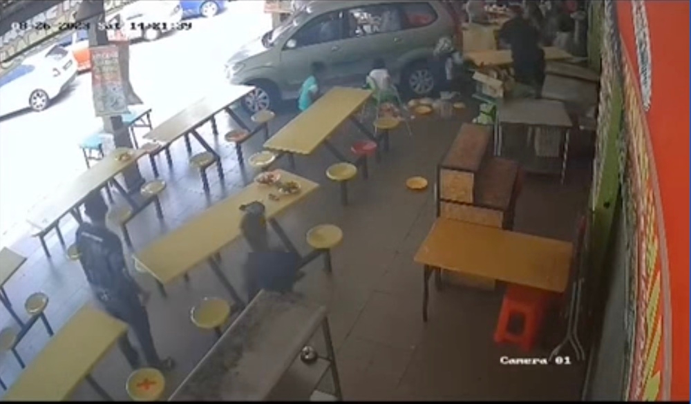 Diners at Medan Selera Tanjung Kling here had a terrifying moment yesterday when a teenager crashed his mother’s Toyota Avanza into the food court. — Screengrab from Instagram