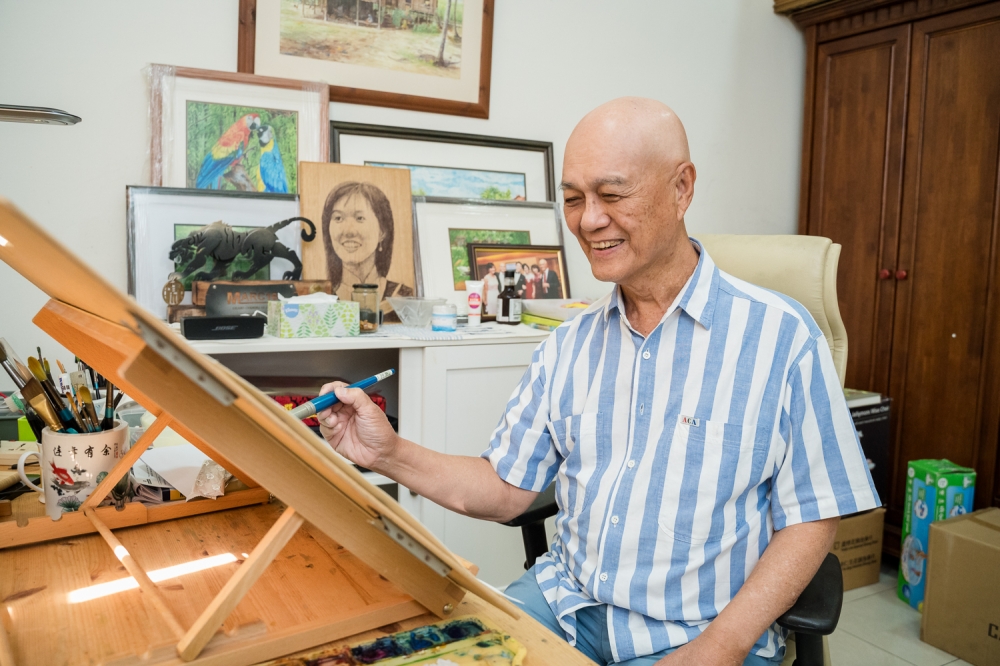 Civil servant turned artist Yeow Teck Chai at work in his humble art studio. — Picture by Raymond Manuel