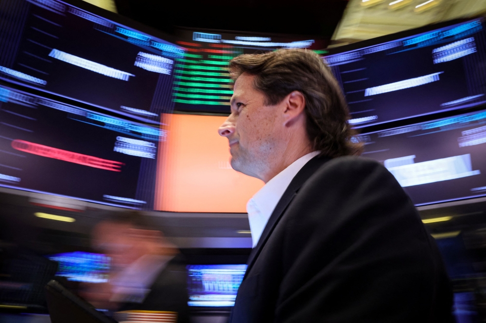 Traders work on the floor of the New York Stock Exchange in New York August 29, 2023. — Reuters pic