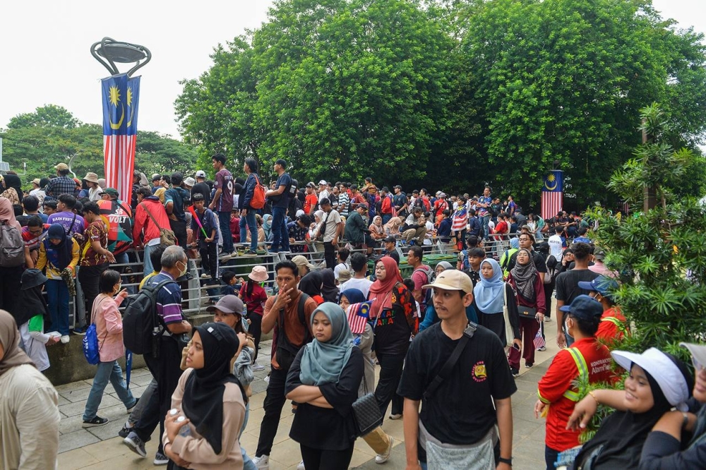 The atmosphere was electric as thousands of Malaysians, dressed in their best attire, surged towards the main procession area as early as 5am, embracing the cool morning air. ― Picture by Miera Zulyana