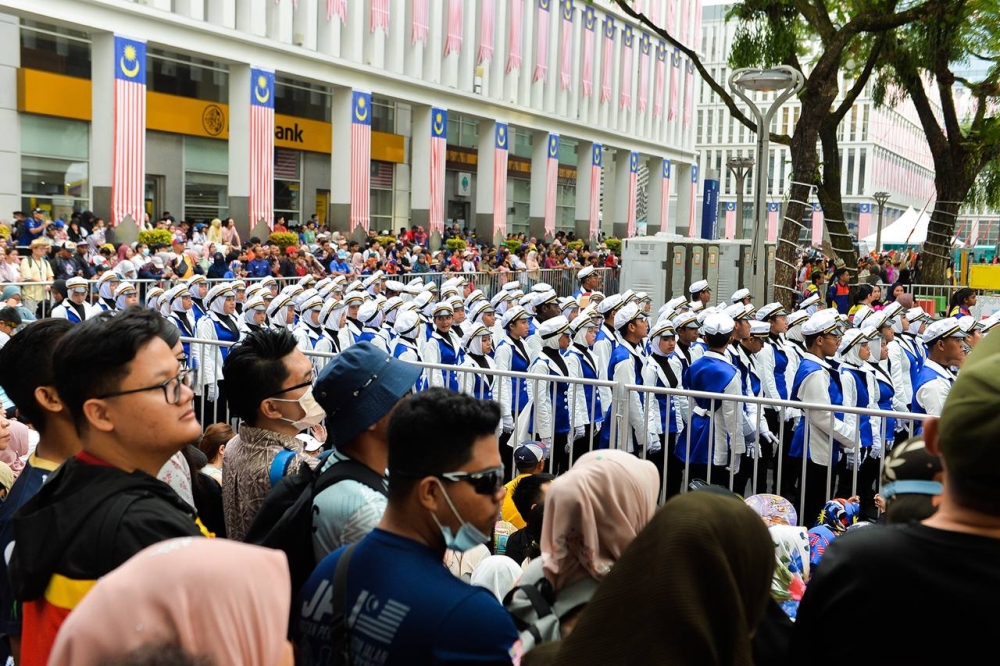 Parade participants, dressed smartly in their sharply pressed uniforms, radiated enthusiasm. ― Picture by Miera Zulyana