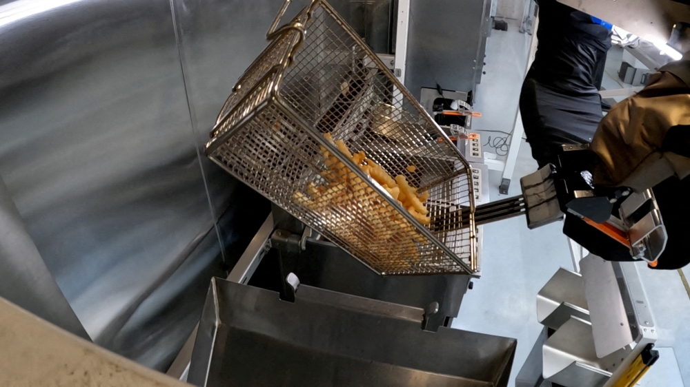 The Flippy 2 robot takes fries out of a vat of oil at a lab of manufacturer Miso Robotics in Pasadena, California September 27, 2022 in this screen grab from a Reuters video. — Reuters pic
