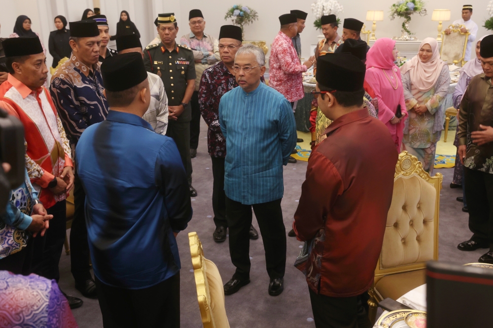 Yang di-Pertuan Agong Al-Sultan Abdullah Ri’ayatuddin Al-Mustafa Billah Shah with families of police personnel who died in the Lahad Datu armed incursion in 2013 at the National Palace, Kuala Lumpur, August 31, 2023. — Bernama pic 