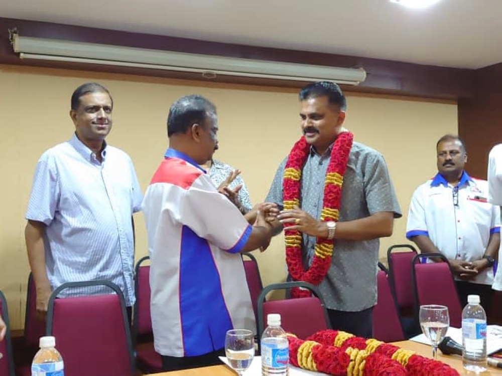 MIC vice president Datuk M. Asojan accepts a garland at the Indian Chamber of Commerce Building in Larkin, Johor Baru, on August 31, 2023. — Picture by Ben Tan