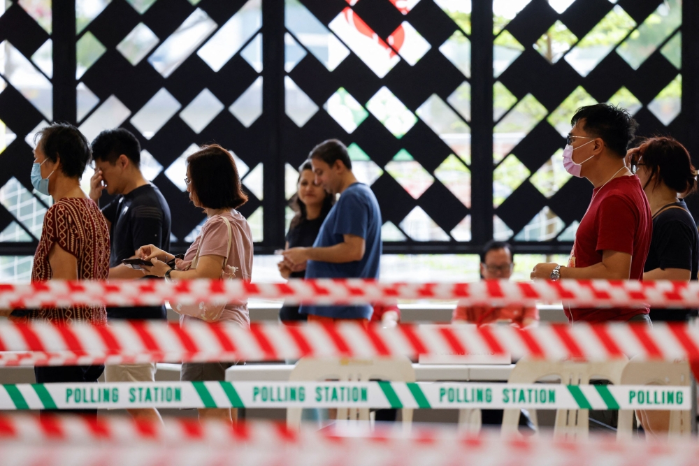 Singaporeans head to the polls today in the city-state’s first contested presidential election in more than a decade, a vote being closely watched as an indication of support for the ruling party after a rare spate of political scandals. — Reuters pic