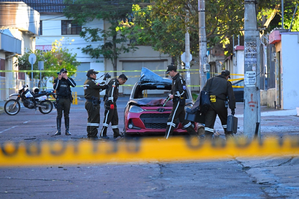 Ecuador’s capital Quito was rocked by attacks with grenades and two car bombs overnight, followed hours later by inmates in six prisons taking hostage 57 prison guards and police officers on Thursday, officials said. — AFP pic