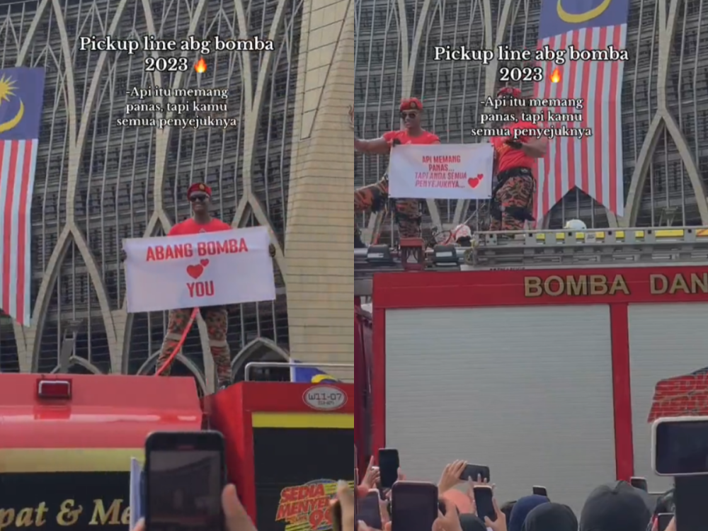 The Abang Bomba holding placards with pick-up lines at the 2023 National Day celebration in Dataran Putrajaya yesterday. — Screenshot via TikTok/mlyfrhn
