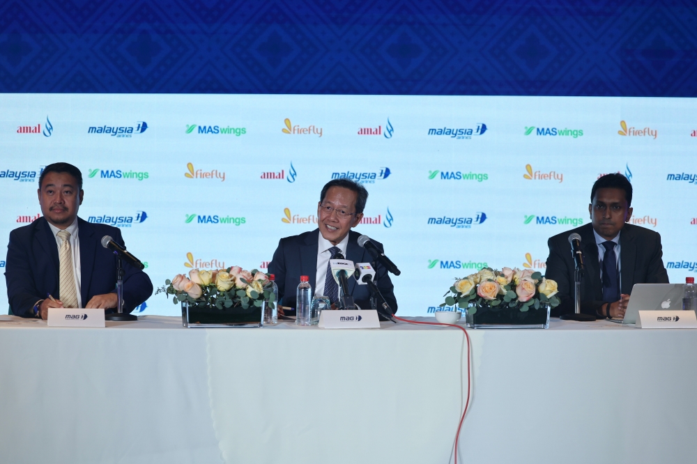 (From left) Malaysia Aviation Group CEO Luqman Mohd Azmi, group managing director Datuk Captain Izham Ismail and Chief Commercial Officer Dersenish Aresandiran are seen during a media conference in conjunction with the Malaysian Association of Tour and Travel Agents (Matta) Fair at Mitec in Kuala Lumpur September 1, 2023. — Bernama pic