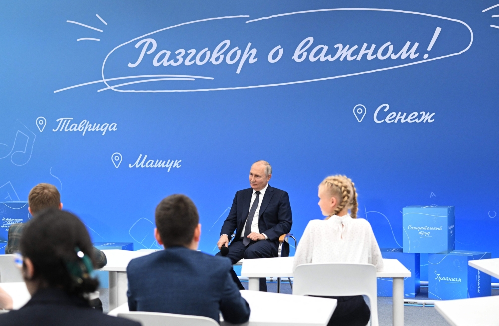 In this pool photograph distributed by Sputnik agency Russian President Vladimir Putin speaks with schoolchildren during a lecture called 'Important Conversations' in Solnechnogorsk in the Moscow region on September 1, 2023. — AFP pic