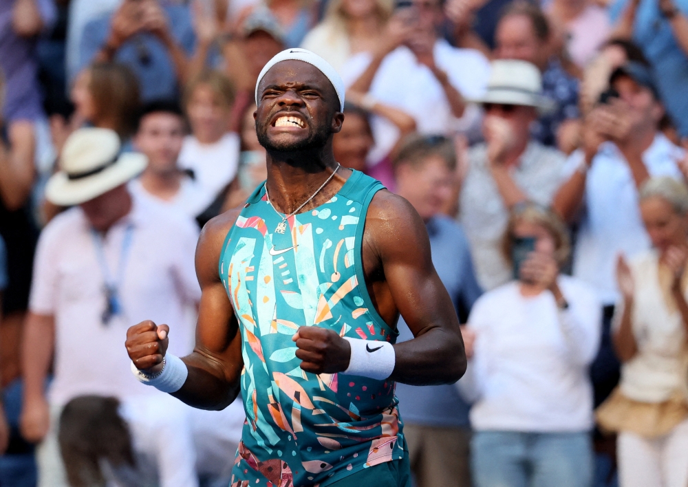 Frances Tiafoe (pic) celebrates winning his third round match against France's Adrian Mannarino in New York September 1, 2023. ― Reuters pic