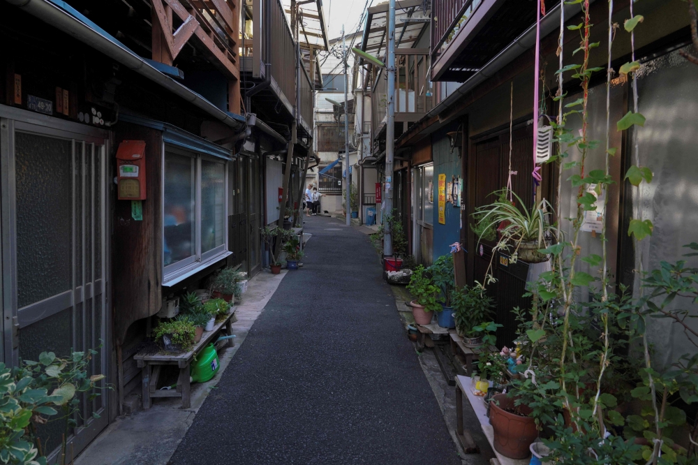 This photo taken on August 23, 2023 shows an alley in an area with dense wooden houses in Arakawa Ward, Tokyo. — AFP pic