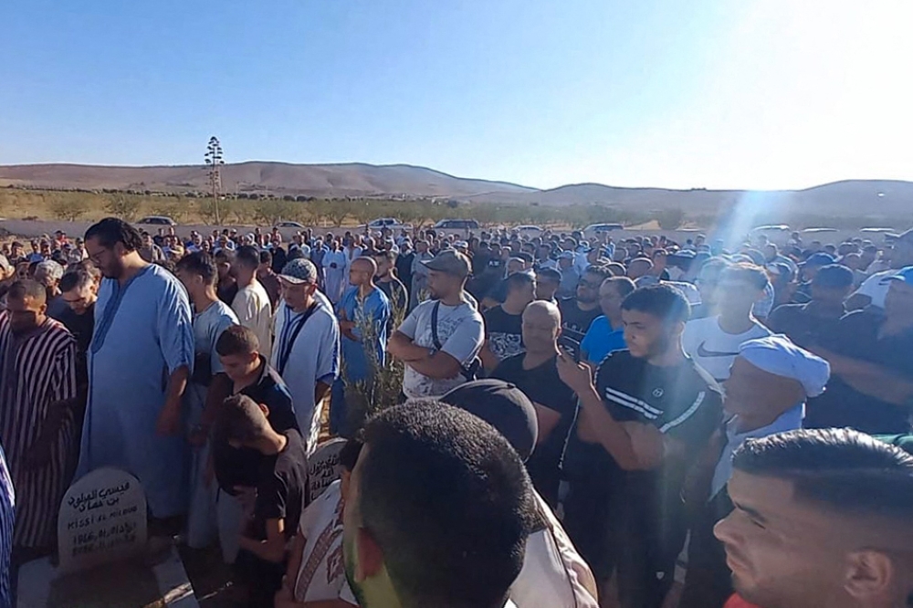 Mourners attend the funeral of Bilal Kissi, shot dead by the Algerian coastguard when he and a fellow jet skier strayed across the maritime border between Algeria and Morocco, in the city of Saidia in northeastern Morocco on August 31, 2023. — AFP pic