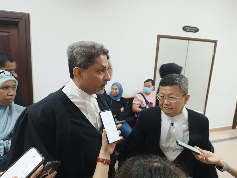 Shankar and Tan speak with reporters following proceedings. — Borneo Post Online pic