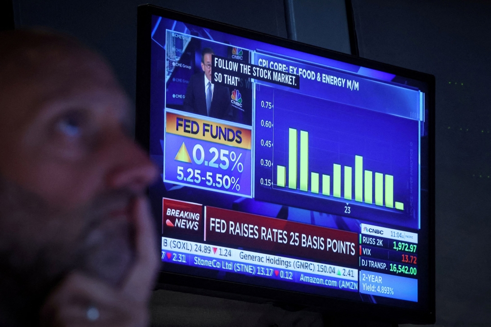 Markets rise as US jobs data ease rate pressure on Fed | Malay Mail