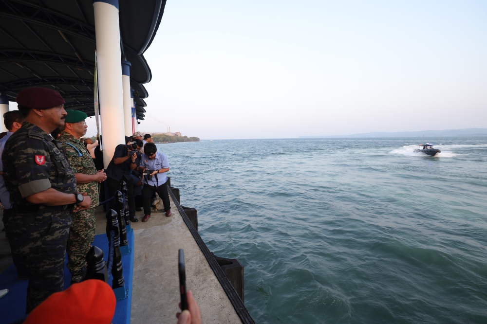 The Yang di-Pertuan Agong, Al-Sultan Abdullah Ri’ayatuddin Al-Mustafa Billah Shah watches a demonstration by ESSCom Marine Operations and Special Forces Divisions on their capabilities in handling boats and parachutes, Lahad Datu Marine Police Base, September 4, 2023. — Bernama pic 