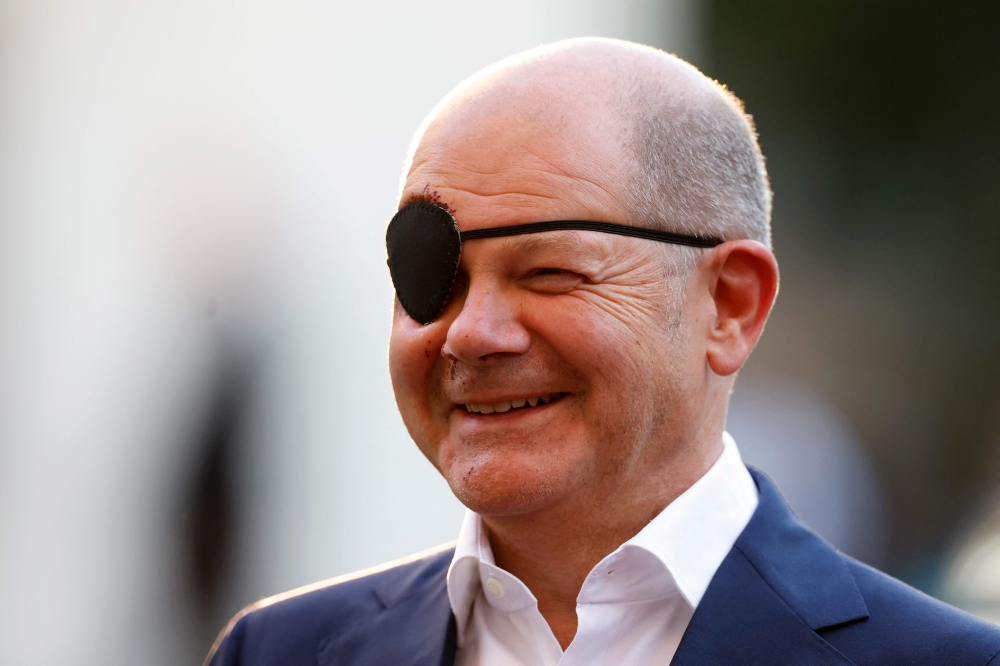 German Chancellor Olaf Scholz, wearing an eyepatch after injuring his face while jogging, attends the annual St Michael reception of the Catholic Church in Germany, in Berlin on September 4, 2023. — AFP pic