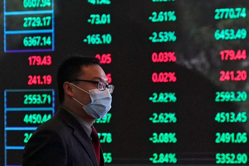 A man wearing a protective mask is seen inside the Shanghai Stock Exchange building, as the country is hit by a new coronavirus outbreak, at the Pudong financial district in Shanghai February 28, 2020. — Reuters pic