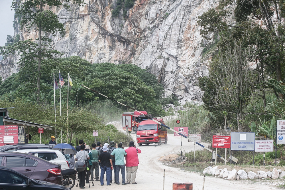 Perak Fire and Rescue Department personnel at the limestone quarry after the rockfall incident at Jalan Cameron Highland Keramat Pulai, September 5, 2023. — Picture by Farhan Najib
