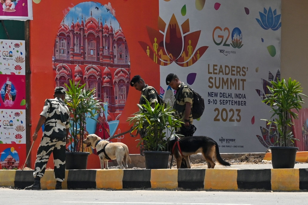 Security operation include sniffer dogs as well. — AFP pic