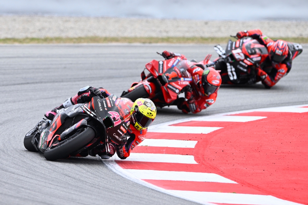 Aprilia Spanish rider Aleix Espargaro (left), Ducati Italian rider Francesco Bagnaia (centre) and Aprilia Spanish rider Maverick Vinales compete during the MotoGP sprint race of the Catalunya Moto Grand Prix at the Circuit de Catalunya on September 2, 2023 in Montmelo on the outskirts of Barcelona. — AFP pic 
