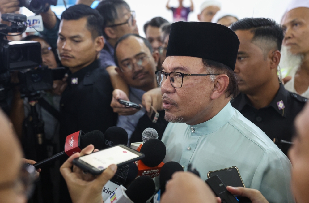 Prime Minister Datuk Seri Anwar Ibrahim speaks to the media after Friday prayers at Masjid Jamek Seri Petaling in Kuala Lumpur, September 8, 2023. — Bernama pic 