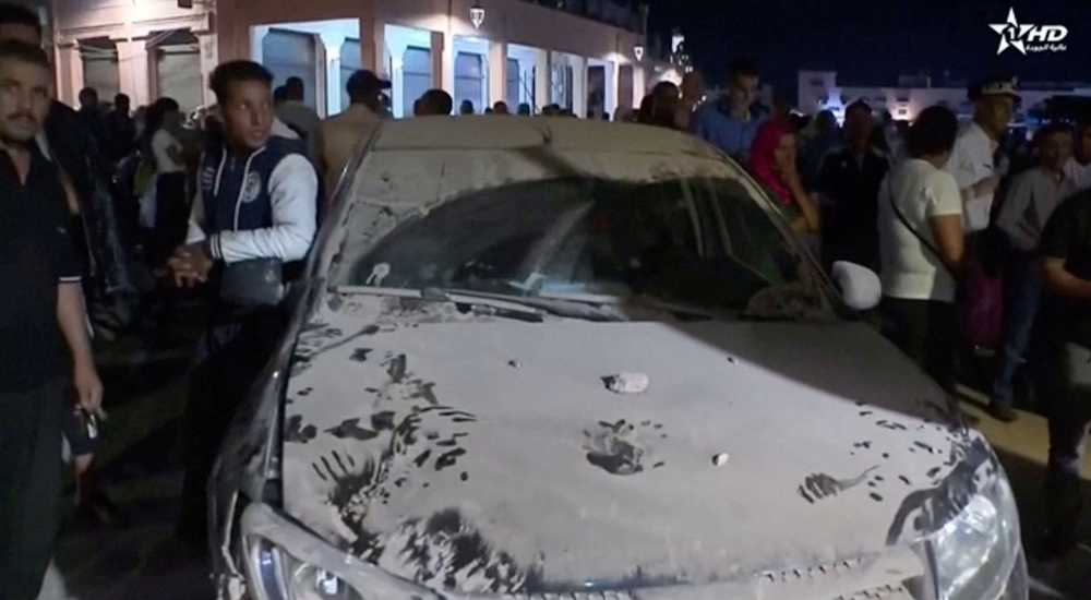 A car is covered in dust in the aftermath of the earthquake in Marrakech, Morocco September 9, 2023 in this screen grab taken from a video. — Reuters/Al Oula TV
