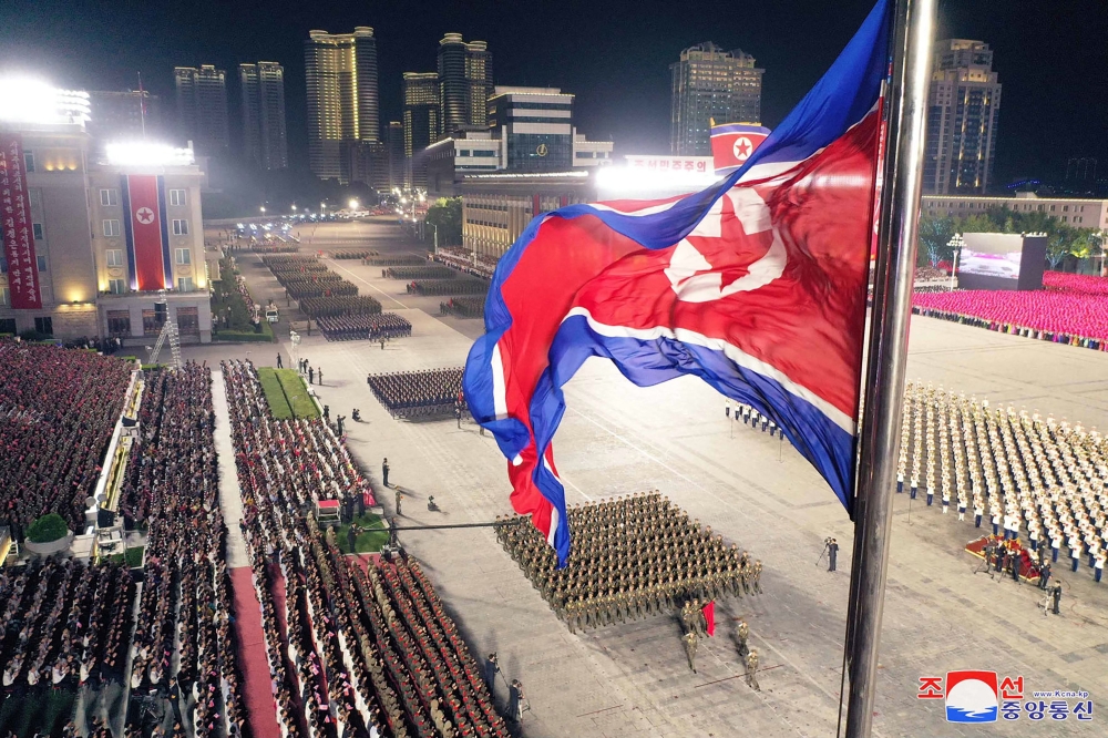 North Korea marked its founding anniversary with a parade attended by leader Kim Jong-un as well as Russian diplomats and a high-ranking Chinese delegation, state media said today. — AFP pic/KCNA via KNS