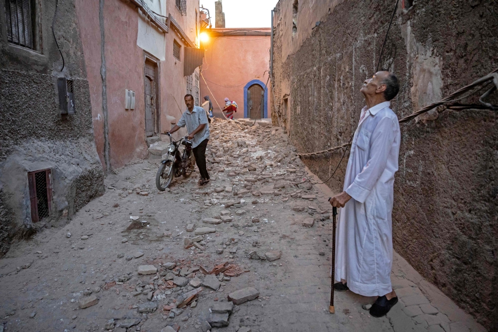 A resident looks at a damaged building following a 6.8-magnitude quake in Marrakesh on September 9, 2023. — AFP pic