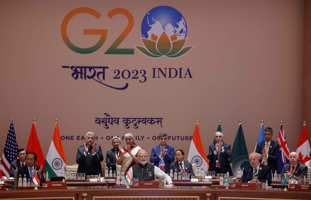 India’s Prime Minister Narendra Modi (sixth from the left) looks on during at the start of the second working session of the G20 Leaders’ Summit at the Bharat Mandapam in New Delhi on September 9, 2023.— AFP pic