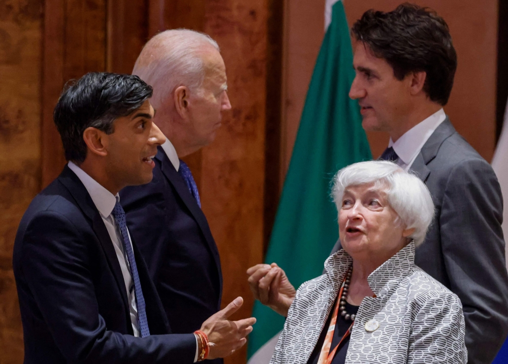 Britain’s Prime Minister Rishi Sunak (left) speaks with US Treasury Secretary Janet Yellen (second right) as US President Joe Biden (second left) speaks with Canada’s Prime Minister Justin Trudeau before the start of the second working session meeting at the G20 Leaders' Summit at Bharat Mandapam in New Delhi on September 9, 2023. — AFP pic