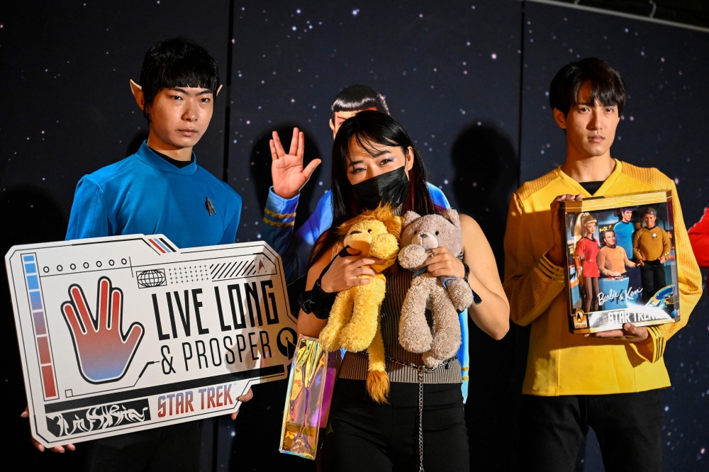 A Chinese fan poses for photos during mainland China’s first official fandom event for science-fiction adventure franchise Star Trek, at a shopping mall in Beijing on September 9, 2023. — AFP pic