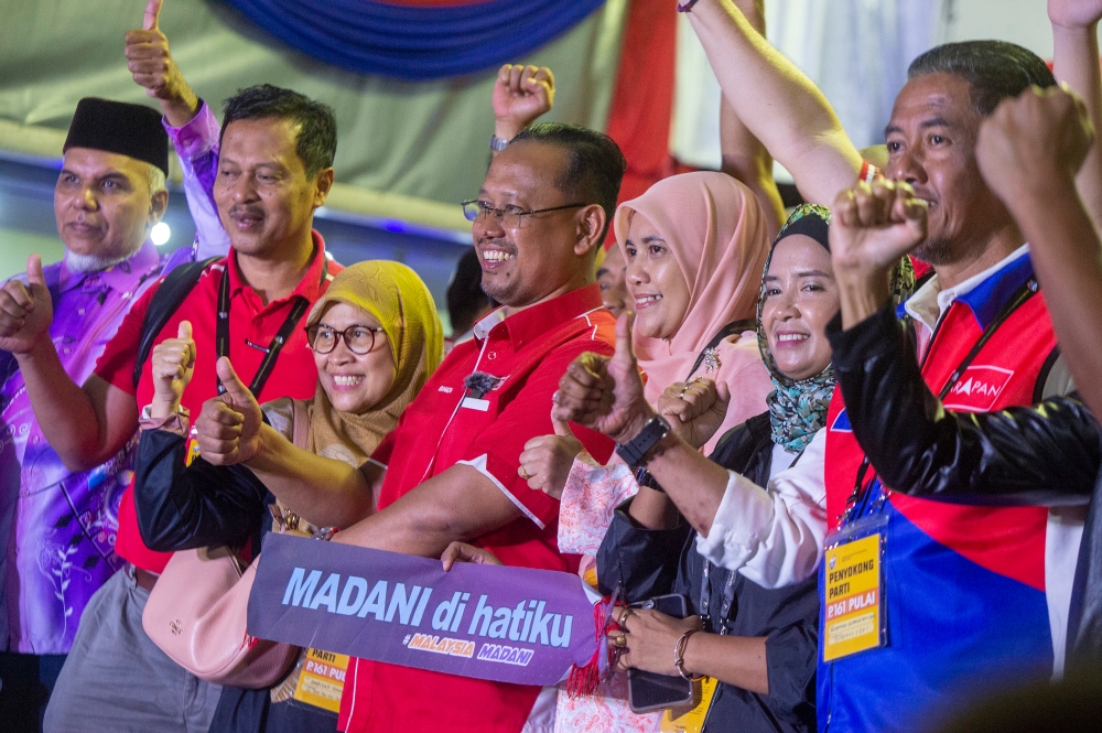 Newly elected Pulai Member of Parliament Suhaizan Kayit reacts after the announcement of Pulai by-election results at Dewan Jubli Intan Sultan Ibrahim in Johor Baru September 9, 2023. — Picture by Shafwan Zaidon